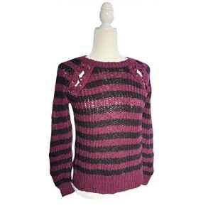 Burgundy and black striped sweater with grommet laced detailing on the shoulders